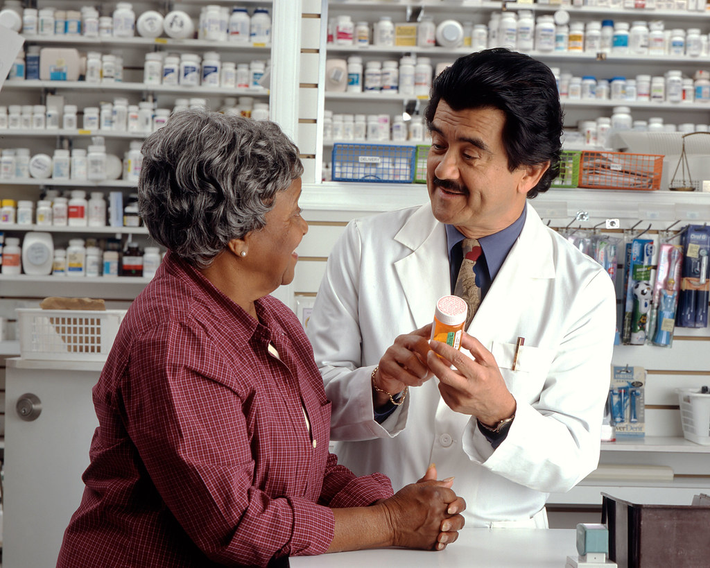 Stock image of pharamacy and client